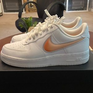 White/orange Nike Air Force 1’s size 9.5.